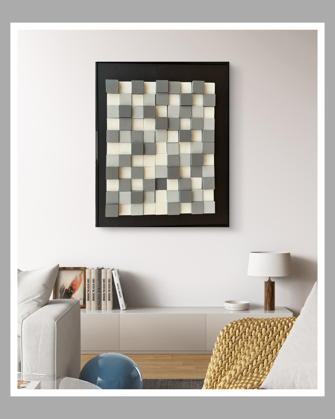 3D wall artwork featuring a grid of grey and white wooden blocks arranged in varying depths to create a textured, modern design.