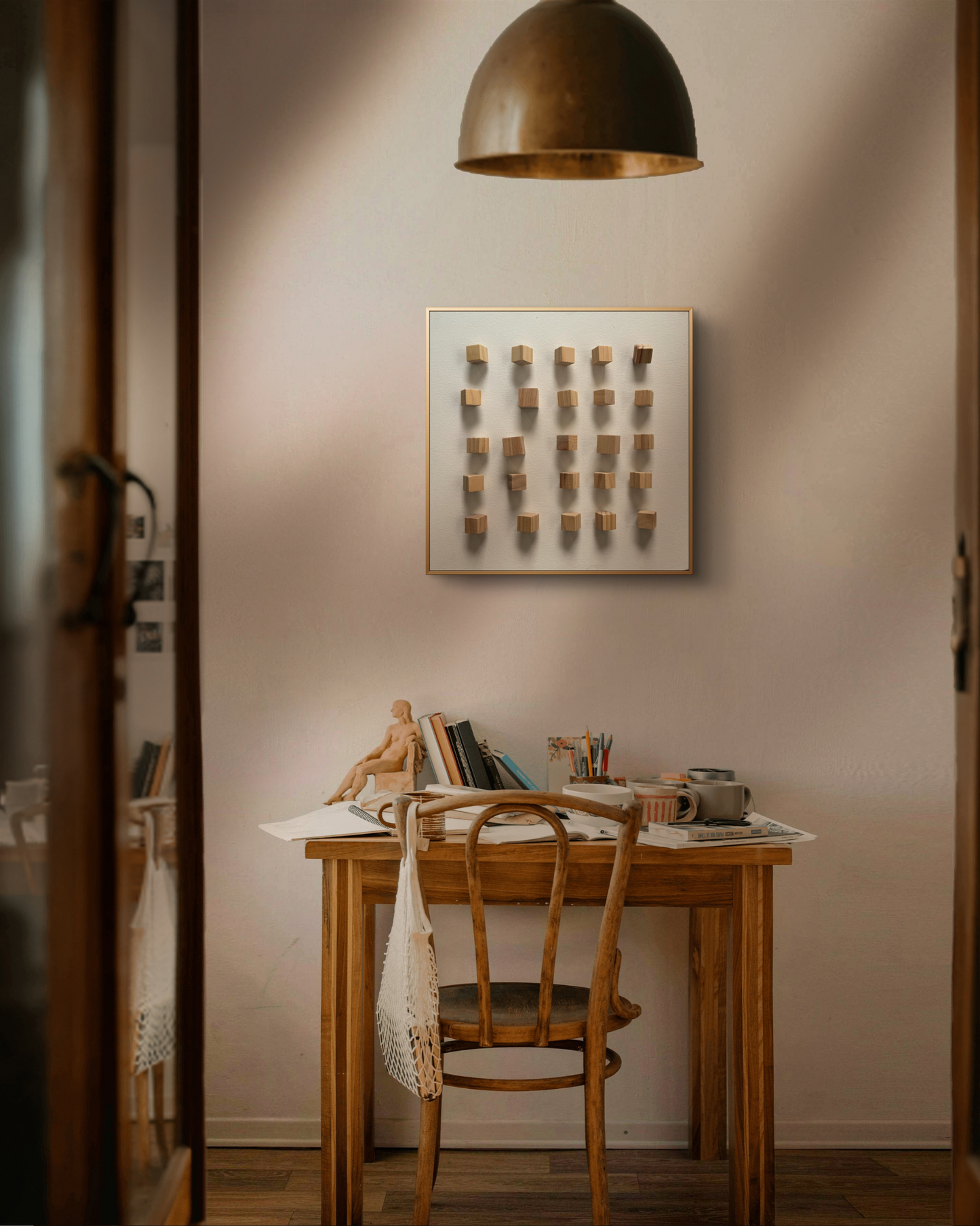 Minimalist 3D wall art with handcrafted wooden cubes arranged in a rhythmic grid on a white canvas.