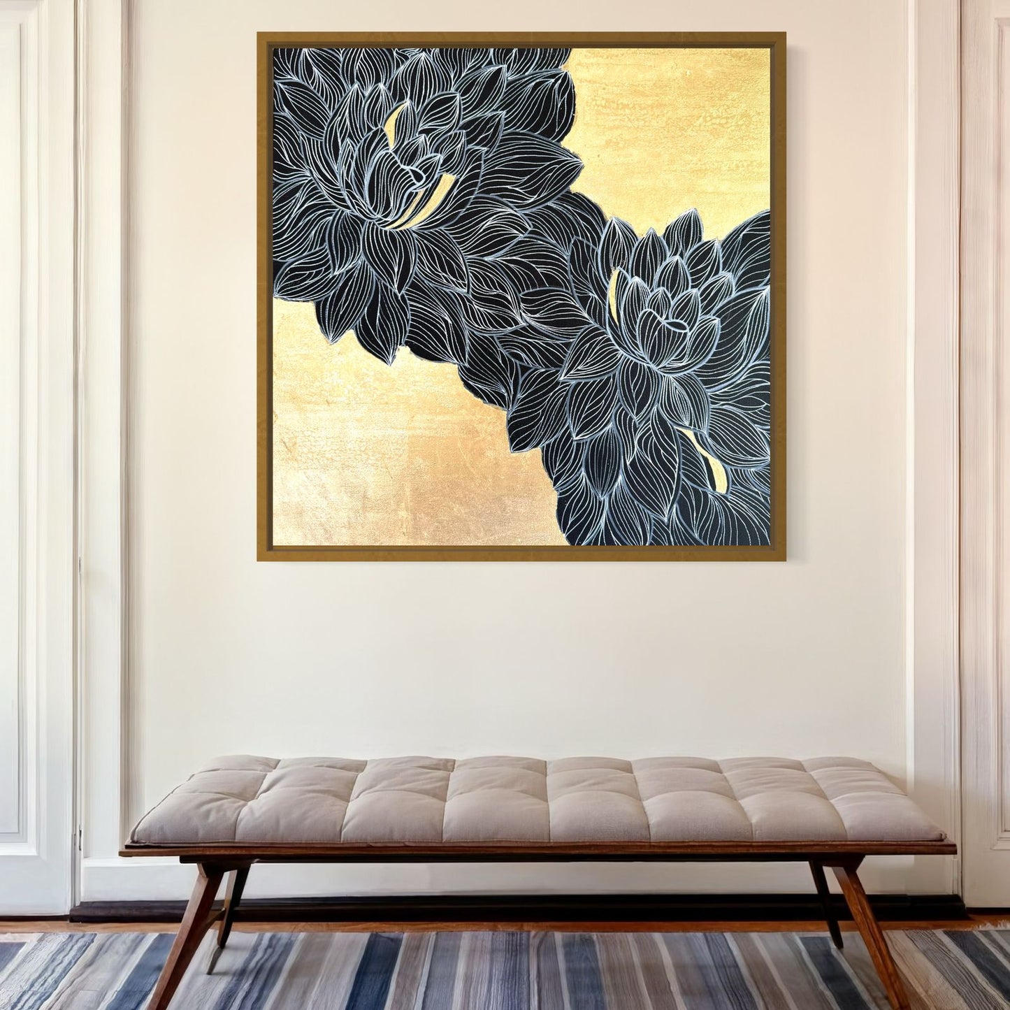 A sophisticated living room in gold and blue, showcasing a grand gold chandelier and exquisite lotus-inspired art piece.