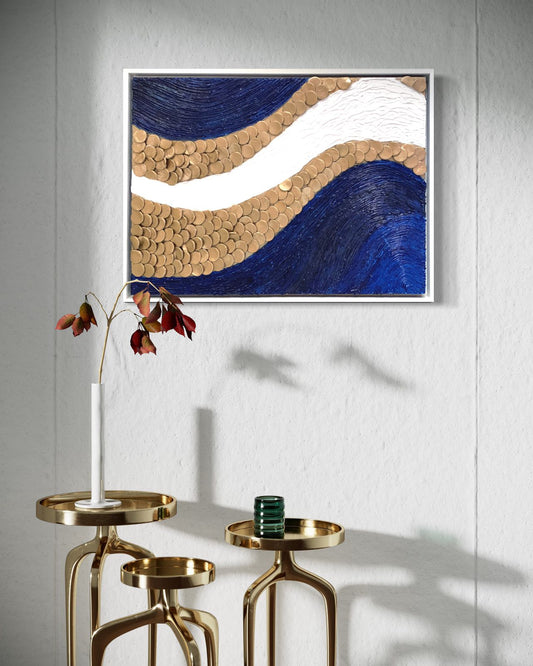 A textured painting of a blue and gold wave, enhancing interior decor with elegance and sophistication for any living space.