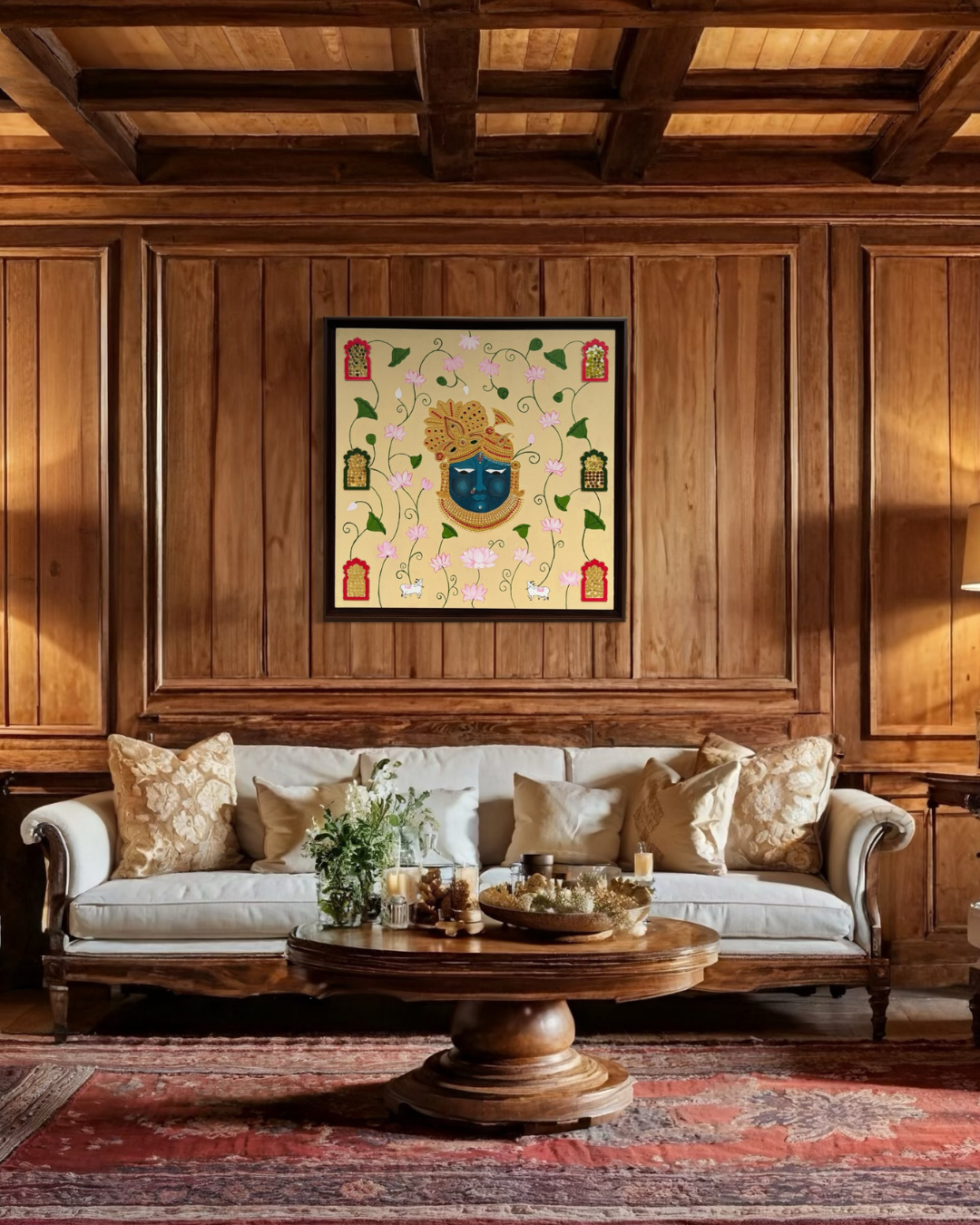 Hand-painted artwork of Lord Krishna’s face in blue with golden embellishments, surrounded by blooming pink lotus flowers, sacred cows, and decorative jaali window designs on a beige background.