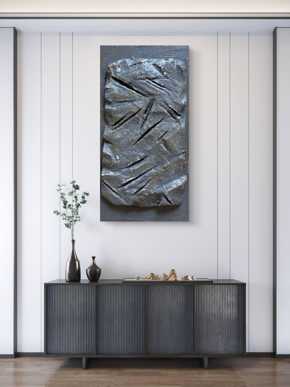 Modern sculptural textured artwork featuring a raw stone-inspired surface with carved linear details in earthy grey tones, designed as a bold contemporary statement piece for luxury interiors.